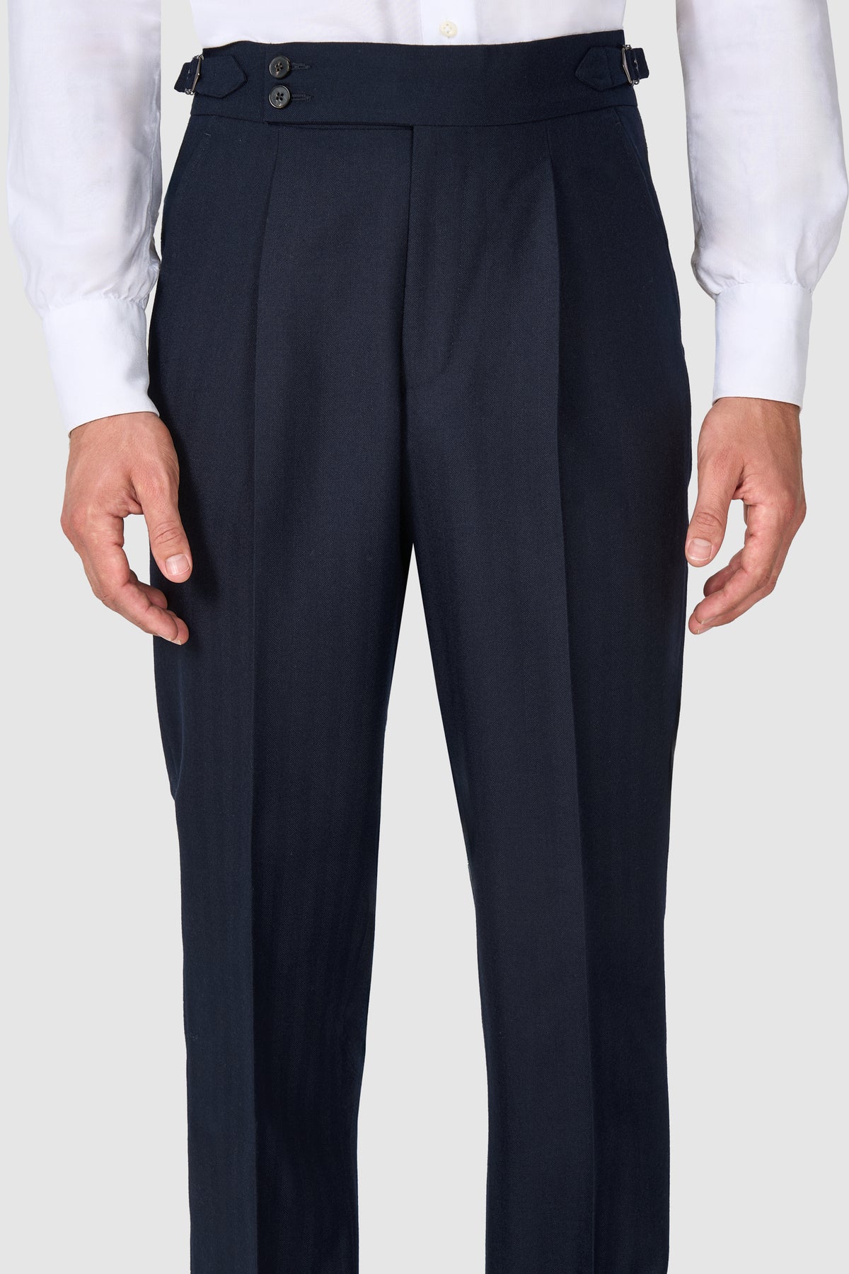 SUITREVIEW Elmhurst navy herringbone wool suit tailored in a slim fit