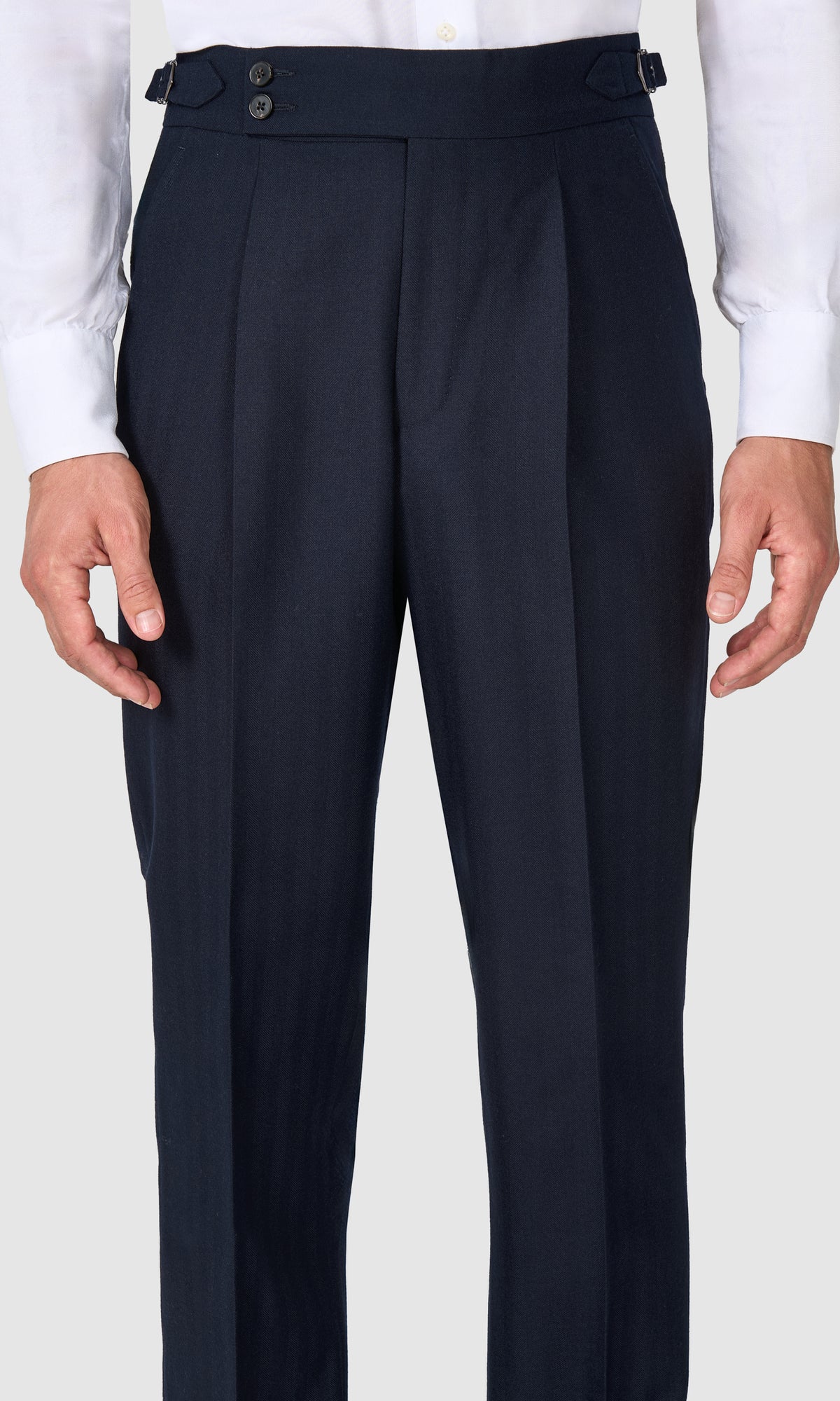 SUITREVIEW Elmhurst navy herringbone wool suit tailored in a slim fit