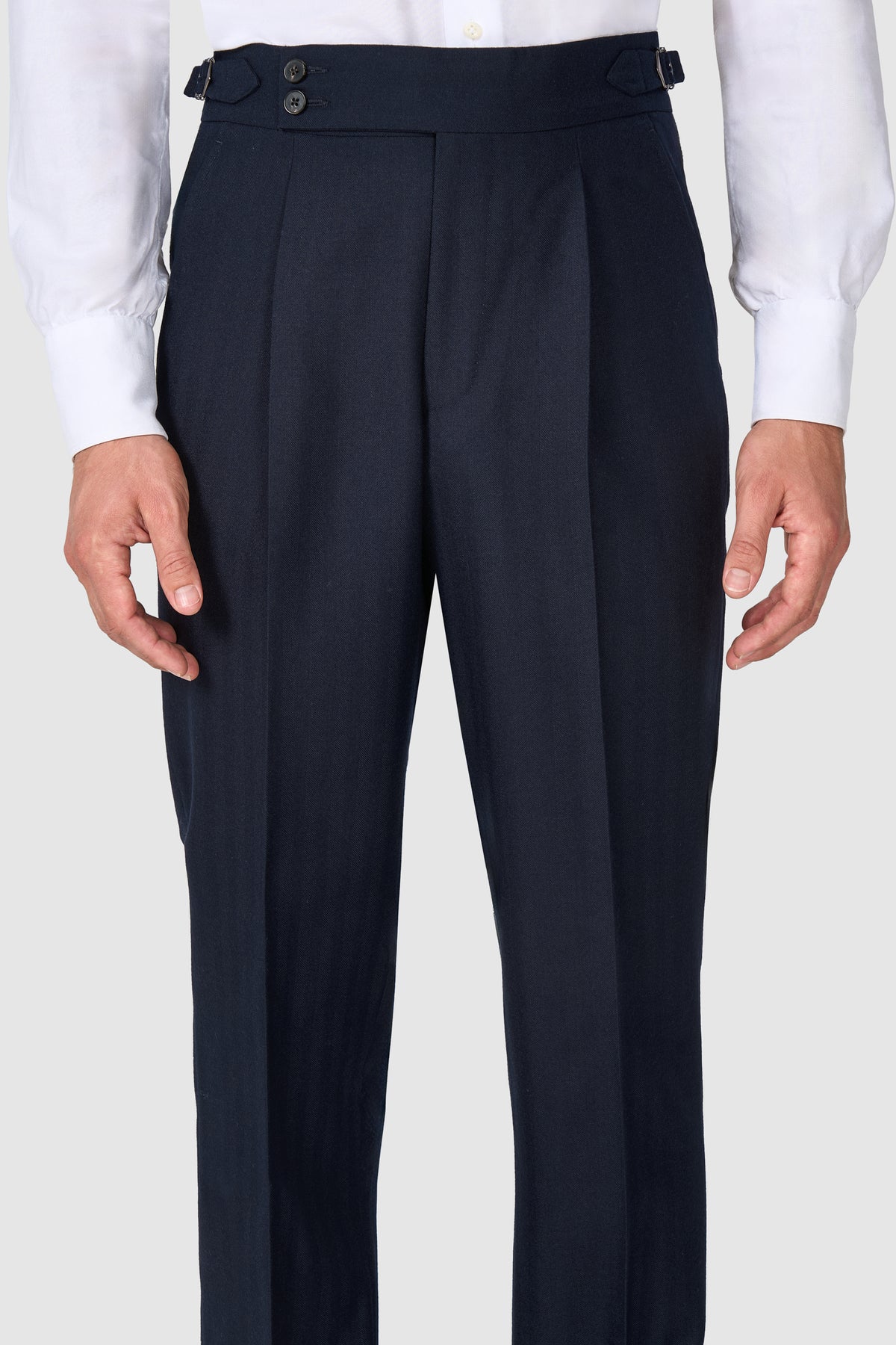 SUITREVIEW Elmhurst navy herringbone wool suit tailored in a slim fit